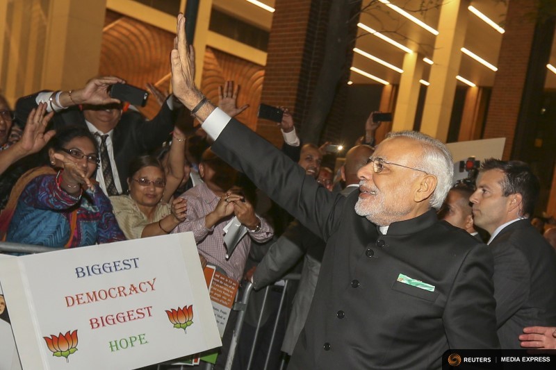 India's Prime Minister Narendra Modi waves to well wishers after arriving at his hotel ahead of the 2015 General Assembly of the United Nations in Manhattan, New York